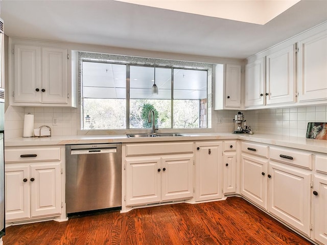 kitchen with dishwasher, dark hardwood / wood-style floors, white cabinetry, and sink