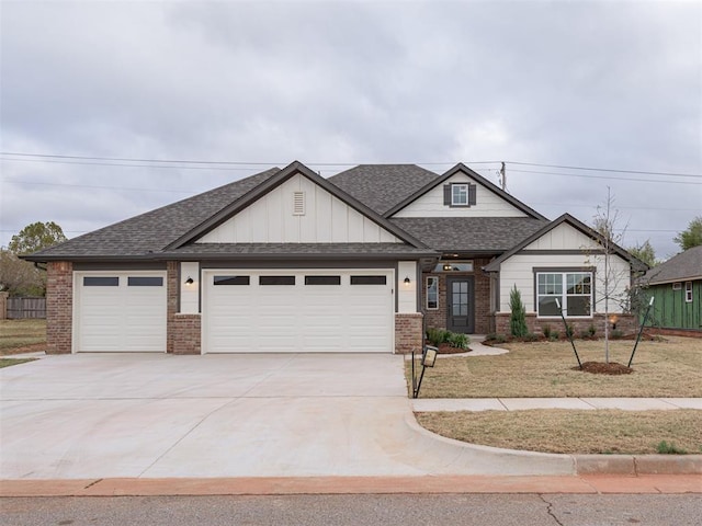 view of front of house with a garage and a front yard