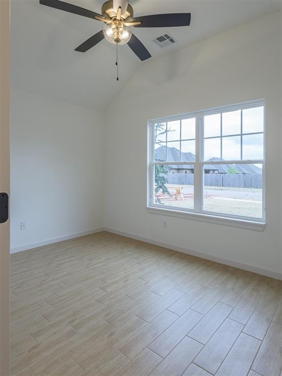 unfurnished room with ceiling fan, lofted ceiling, and light hardwood / wood-style flooring