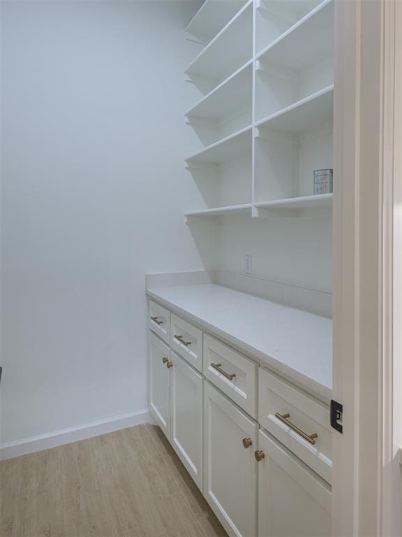 12129 SW 45th Ter, Mustang, OK 73064 - detailed view of wood finished floors and baseboards