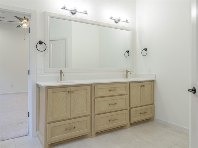 12129 SW 45th Ter, Mustang, OK 73064 - full bathroom featuring double vanity, a ceiling fan, and baseboards