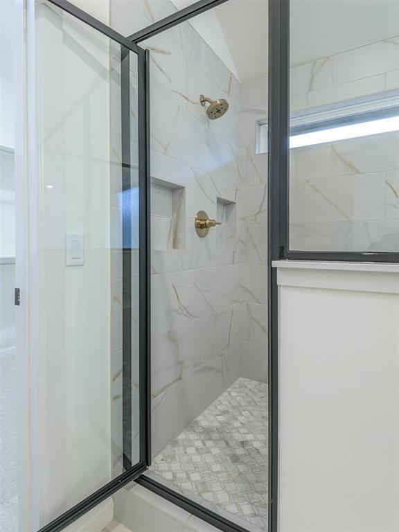 12129 SW 45th Ter, Mustang, OK 73064 - full bath with a shower stall and vaulted ceiling