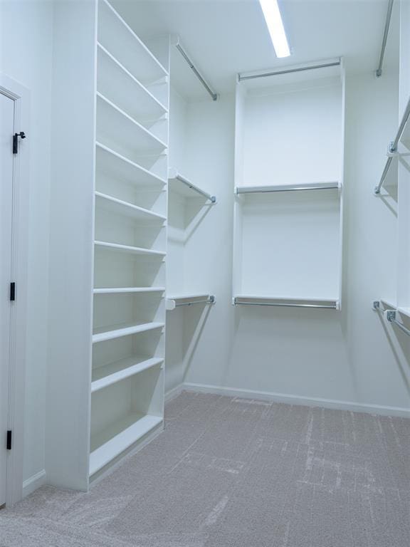 12129 SW 45th Ter, Mustang, OK 73064 - walk in closet with carpet floors
