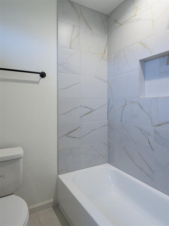 12129 SW 45th Ter, Mustang, OK 73064 - full bathroom with toilet, baseboards, tile patterned flooring, and tub / shower combination