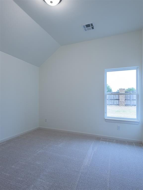 12129 SW 45th Ter, Mustang, OK 73064 - additional living space featuring vaulted ceiling, carpet, and baseboards