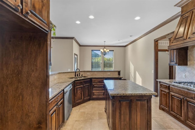 kitchen with a center island, an inviting chandelier, sink, decorative backsplash, and kitchen peninsula