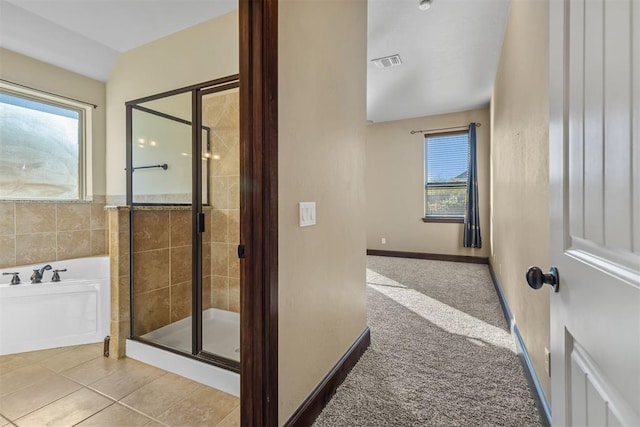 bathroom featuring tile patterned floors and plus walk in shower