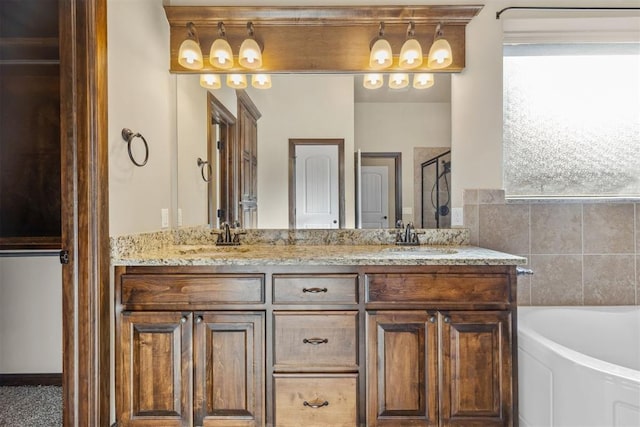 bathroom with vanity and separate shower and tub