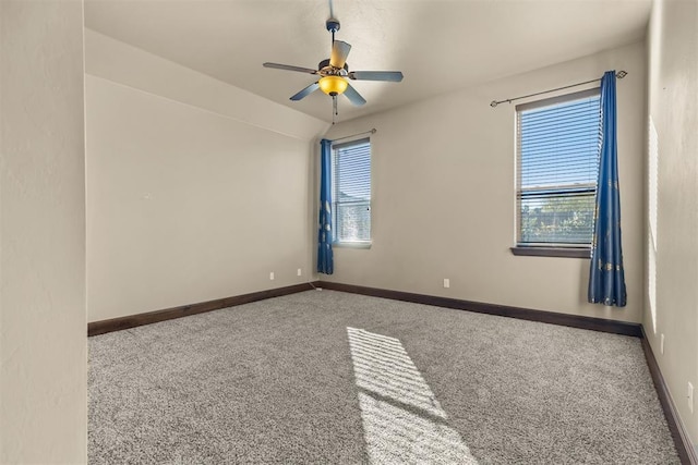 carpeted empty room with ceiling fan