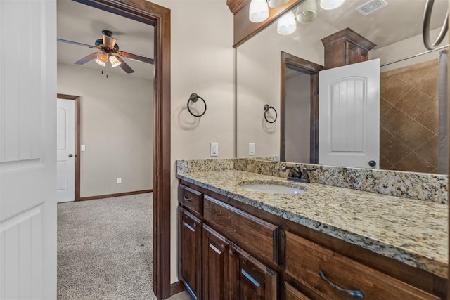 bathroom with ceiling fan and vanity