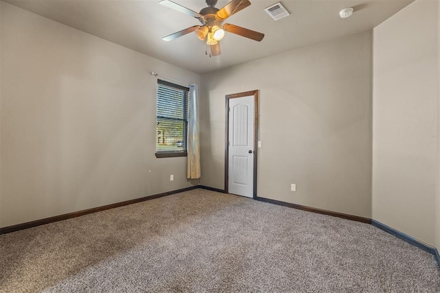 carpeted empty room with ceiling fan