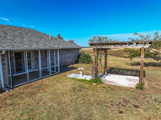 view of yard with a sunroom