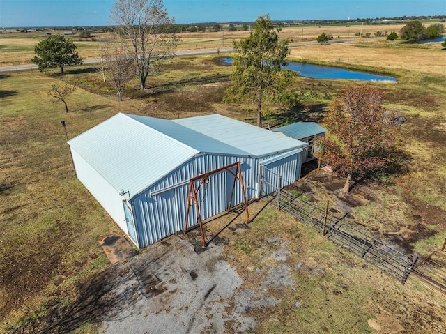 drone / aerial view with a water view and a rural view