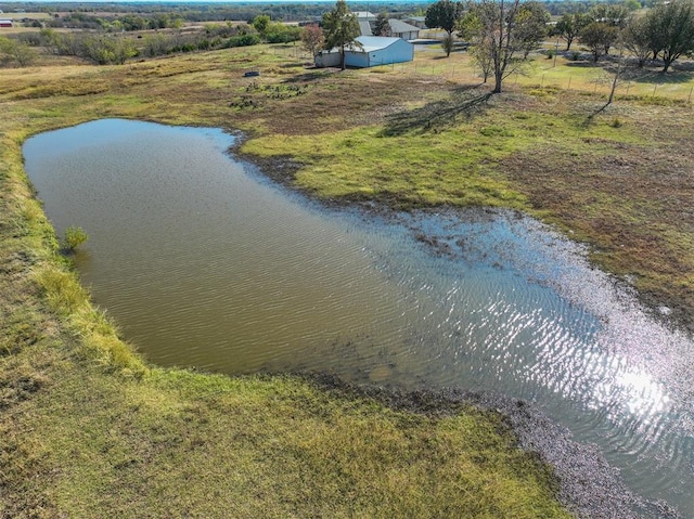 birds eye view of property with a water view and a rural view