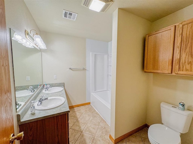 bathroom with tile patterned floors, vanity, and toilet