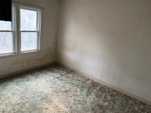 empty room featuring carpet flooring