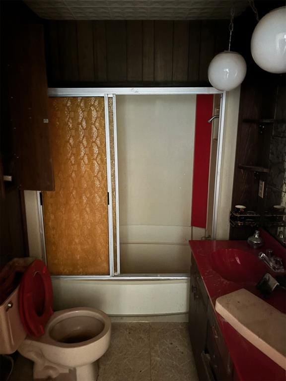 bathroom with shower / bath combination with glass door, vanity, and tile patterned floors