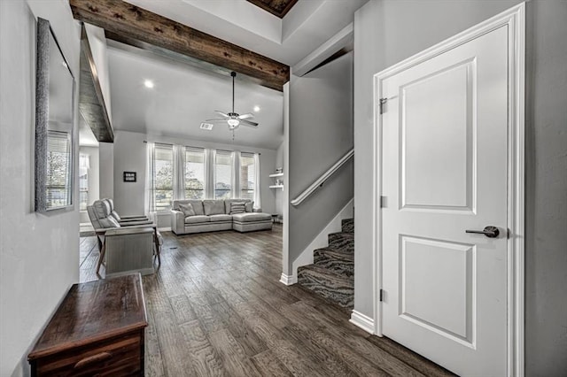 foyer featuring beamed ceiling, ceiling fan, and dark hardwood / wood-style flooring