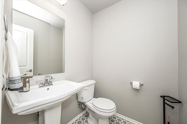 bathroom with sink and toilet