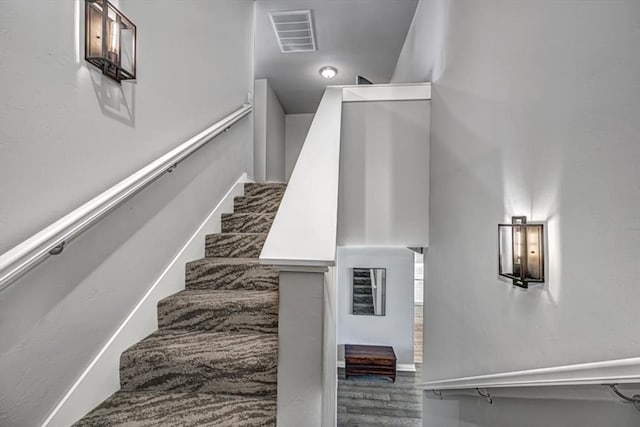 stairway featuring wood-type flooring