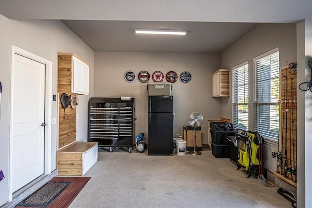 garage with black refrigerator