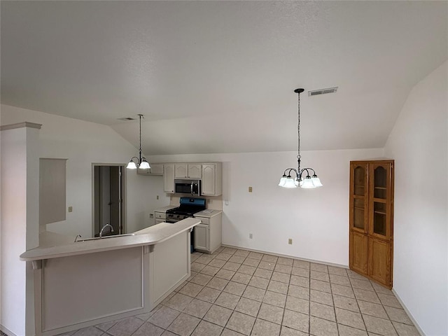 kitchen featuring an inviting chandelier, white cabinets, hanging light fixtures, vaulted ceiling, and black gas range oven