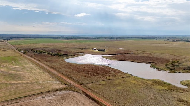 bird's eye view with a water view and a rural view