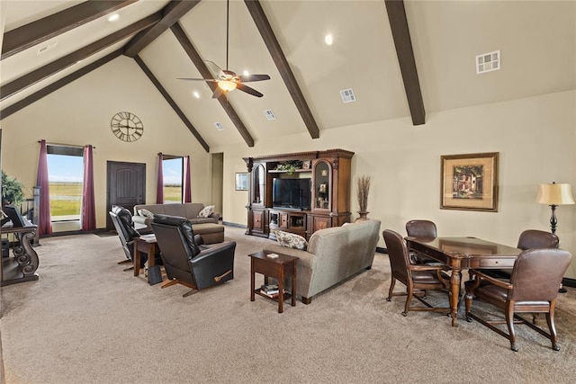 living room with beamed ceiling, light colored carpet, ceiling fan, and high vaulted ceiling