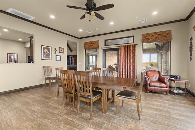 dining area featuring ornamental molding and ceiling fan