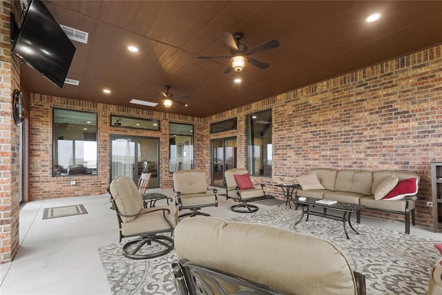 view of patio / terrace with ceiling fan and outdoor lounge area