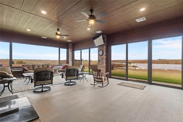 interior space featuring ceiling fan