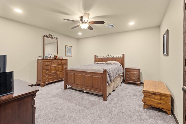 bedroom featuring ceiling fan and light carpet