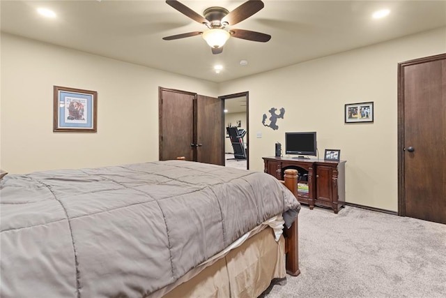 bedroom with light carpet and ceiling fan