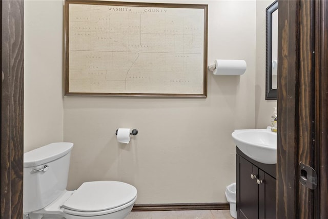 bathroom featuring vanity and toilet