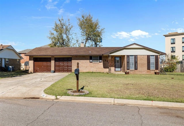 ranch-style house with a front yard and a garage