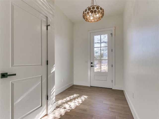 doorway to outside with light hardwood / wood-style floors