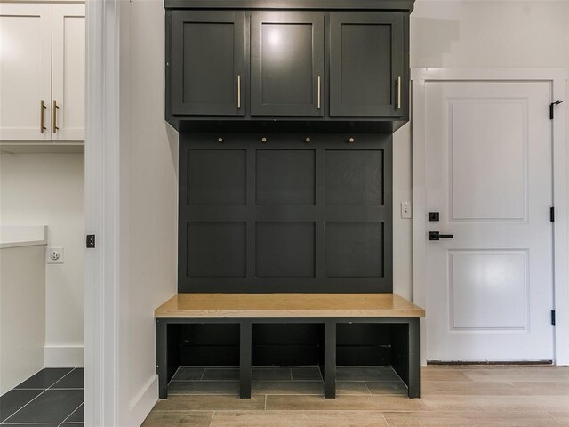 mudroom with light hardwood / wood-style flooring