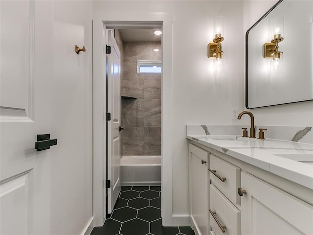 bathroom with vanity, tile patterned floors, and tiled shower / bath combo