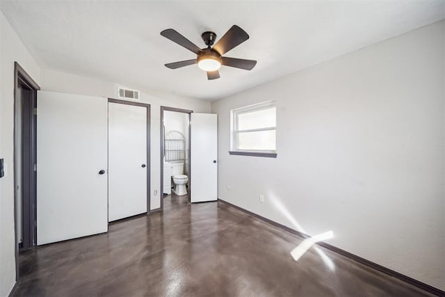 unfurnished bedroom featuring connected bathroom, a ceiling fan, visible vents, finished concrete flooring, and baseboards