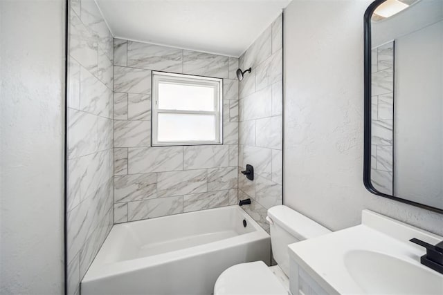 full bathroom featuring a textured wall, vanity, bathtub / shower combination, and toilet