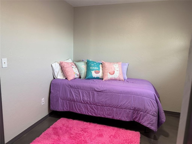 bedroom featuring baseboards