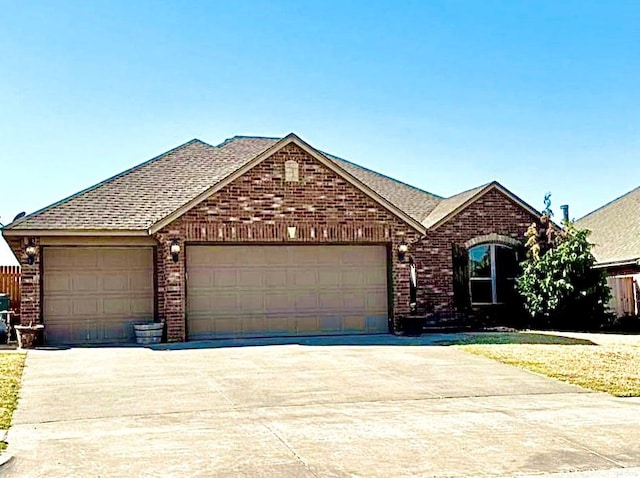 single story home featuring a garage