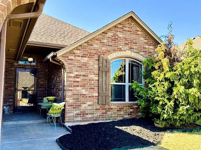 entrance to property with a patio