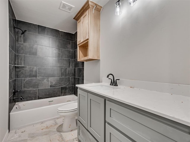 full bathroom featuring vanity, toilet, and tiled shower / bath