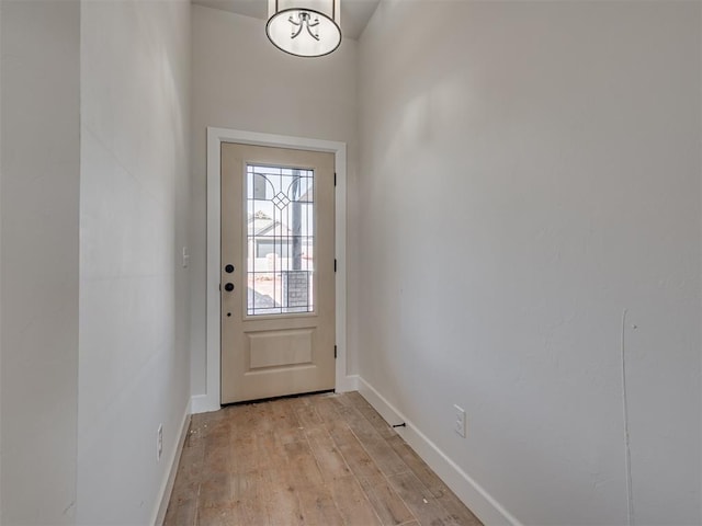 2800 Juneberry Ln, Newcastle, OK 73065 - doorway with baseboards and light wood-style flooring