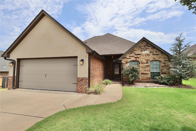 view of front of home featuring a garage and a front lawn