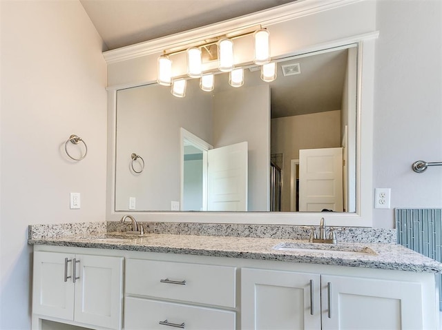 bathroom featuring vanity and an enclosed shower