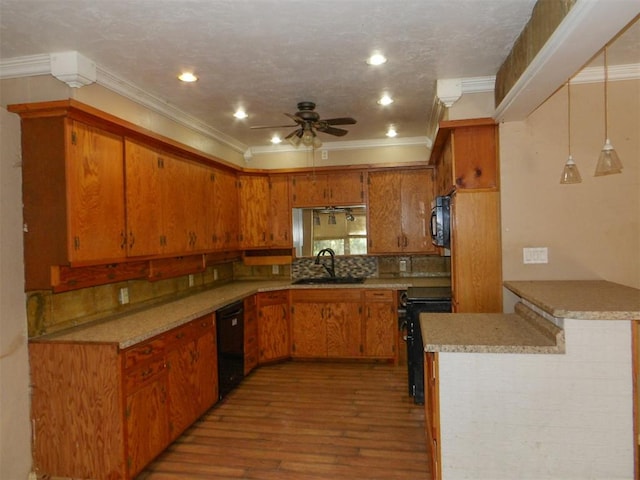 kitchen featuring black appliances, sink, light hardwood / wood-style flooring, ornamental molding, and kitchen peninsula