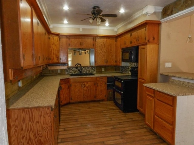 kitchen featuring light wood-type flooring, backsplash, crown molding, sink, and black appliances