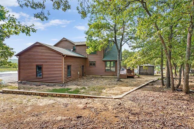 rear view of property featuring a deck